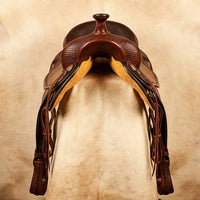 Elatheria Maverick hand tooled basketweave full grain western leather saddle silver conchos