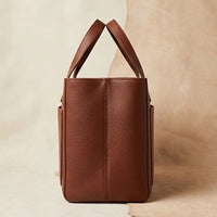Elatheria Hearthstone pebbled full grain tan leather luxury firewood log carrier