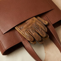 Elatheria Hearthstone pebbled full grain tan leather luxury firewood log carrier