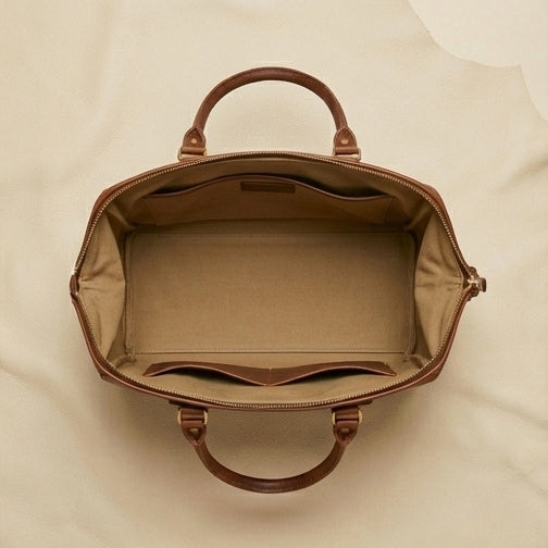 The Voyager full-grain leather weekender duffle — lifestyle travel shot