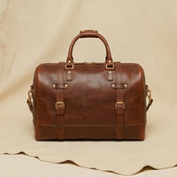 The Voyager full-grain leather weekender duffle bag — front view, Elatheria