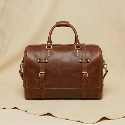 The Voyager full-grain leather weekender duffle bag — front view, Elatheria