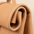Elatheria Voyager minimalist full grain veg tanned leather roll top backpack