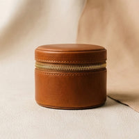 Elatheria Heirloom cylindrical tan leather travel jewelry case brass zipper ring roll