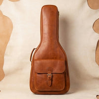 Elatheria Maestro cognac pull-up leather padded guitar gig bag backpack, front view, gift for guitarist
