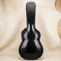 Elatheria Maestro alligator-embossed leather guitar hard case with gold hardware, front view, gift for guitarist