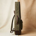 Troubadour waxed canvas gig bag angled view showing leather trim and canvas texture
