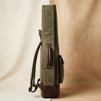 Troubadour waxed canvas gig bag angled view showing leather trim and canvas texture
