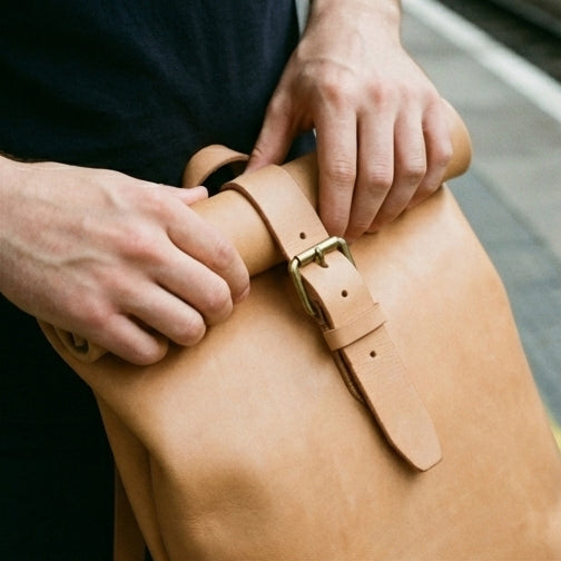 Elatheria Voyager minimalist full grain veg tanned leather roll top backpack