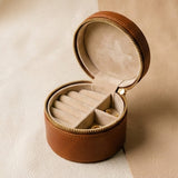 Elatheria Heirloom cylindrical tan leather travel jewelry case brass zipper ring roll