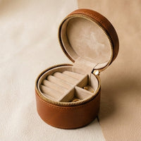Elatheria Heirloom cylindrical tan leather travel jewelry case brass zipper ring roll