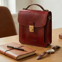 Elatheria Scribe vertical full grain leather crossbody mini briefcase in burgundy