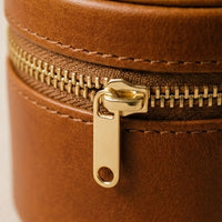 Elatheria Heirloom cylindrical tan leather travel jewelry case brass zipper ring roll