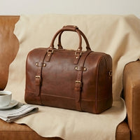 The Voyager leather weekender duffle — rear view showing back panel and carry handles