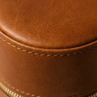 Elatheria Heirloom cylindrical tan leather travel jewelry case brass zipper ring roll
