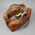 Interior of The Match Point tennis duffle showing slip pockets and capacity