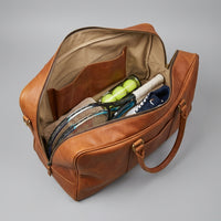 Interior of The Match Point tennis duffle showing slip pockets and capacity
