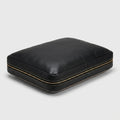 The Haven custom leather orthopaedic pet bed in black full-grain leather, hero angle view