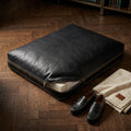 The Haven black leather dog bed with cover unzipped showing orthopaedic foam insert