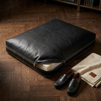 The Haven black leather dog bed with cover unzipped showing orthopaedic foam insert