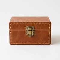 The Keepsake leather memory box closed, front view on white background showing brass clasp