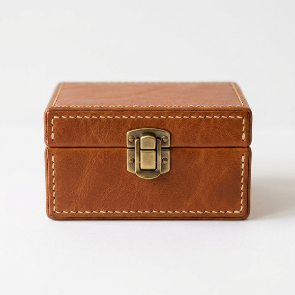 The Keepsake leather memory box closed, front view on white background showing brass clasp