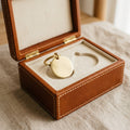 Close up of open The Keepsake leather box showing engravable brass pet ID tag on felt lining