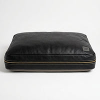 The Haven black leather dog bed front view on white background