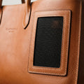 Mesh ventilation panel detail on The Voyager leather pet carrier