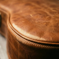 Maestro leather guitar bag lifestyle carry shot, thoughtful gift for him or gift for her