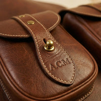 Troubadour Chestnut leather gig bag straight-on front view showing rich chestnut leather tone