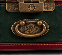 Antique brass central lock and brass handle on The Heirloom Christmas box