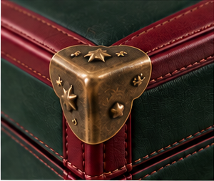 Antique brass corner protector and stitched burgundy leather trim on The Heirloom Christmas