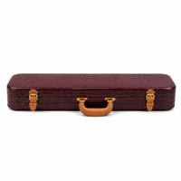 Closed burgundy crocodile-embossed leather violin case with a tan leather handle and brass buckles