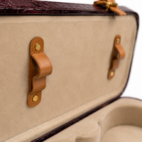 Beige-lined interior lid of the leather violin case with leather bow-holder straps
