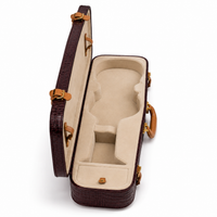Custom leather violin hard case open at an angle, showing the padded neck support and beige velvet lining