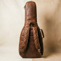 Aviator leather guitar gig bag angled view showing distressed leather texture and patina