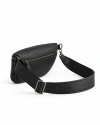 Black Elatheria leather sling bag shown at an angle with its leather strap.