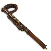 The Laurel carved loop handle with gold leaf detailing, angled view
