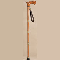 The Regent rosewood folding walking cane standing upright with leather wrist strap and brass collars