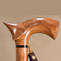 The Regent sculpted rosewood derby handle with black accent ring and brass clip for the wrist strap