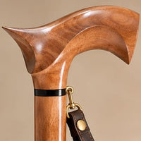 The Regent rosewood derby handle from another angle, with the leather wrist strap clip