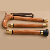 The Regent folding walking cane separated into three sections with threaded brass joints