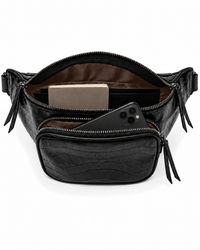 Open black leather belt bag showing dark chocolate lining, a phone and a wallet